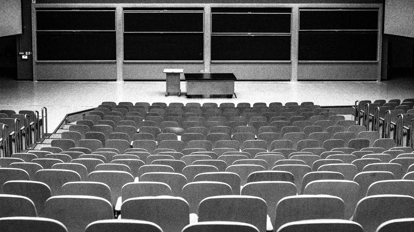 Black and white image of a college lecture hall.