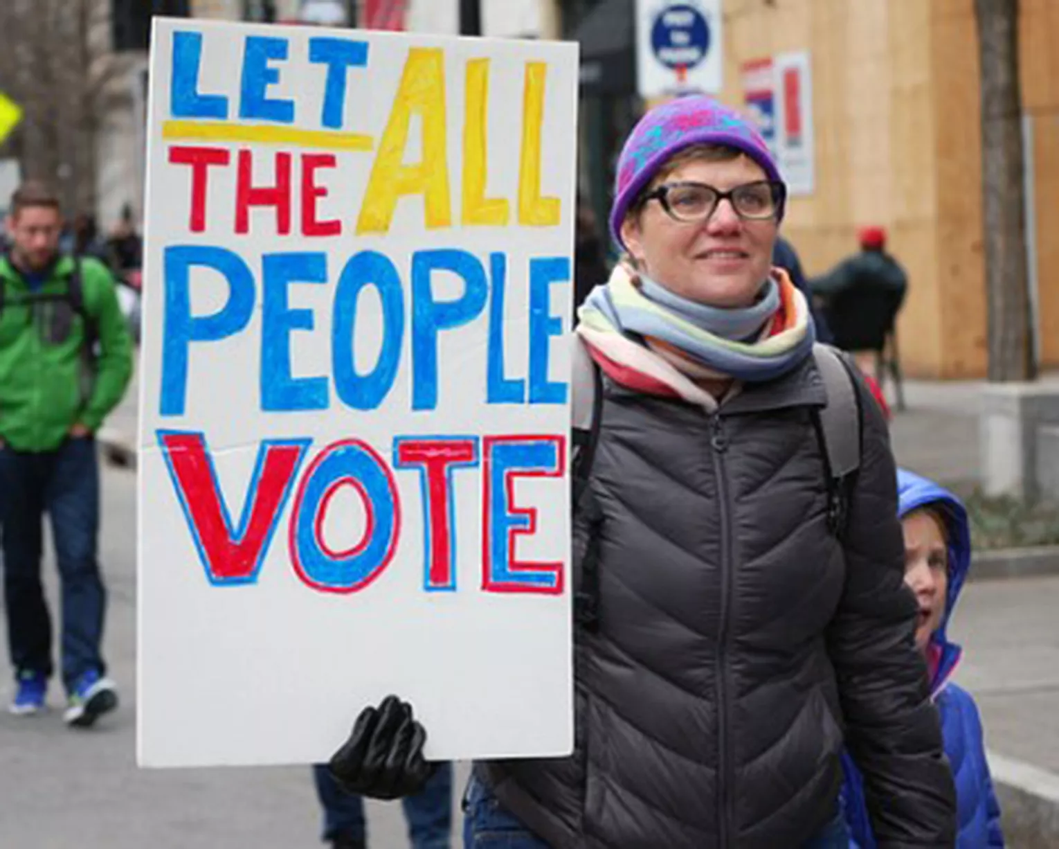 women marching in voting rights protest