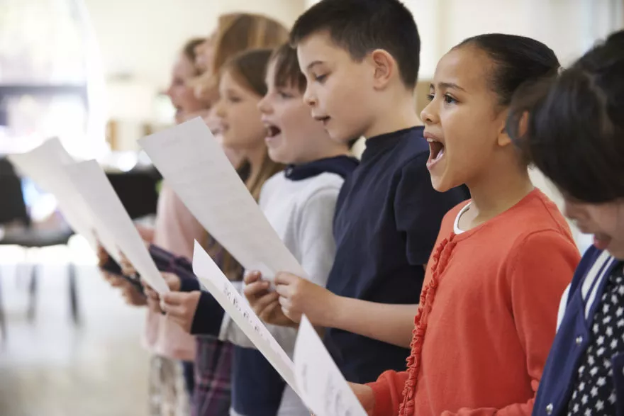 Group of school children singing