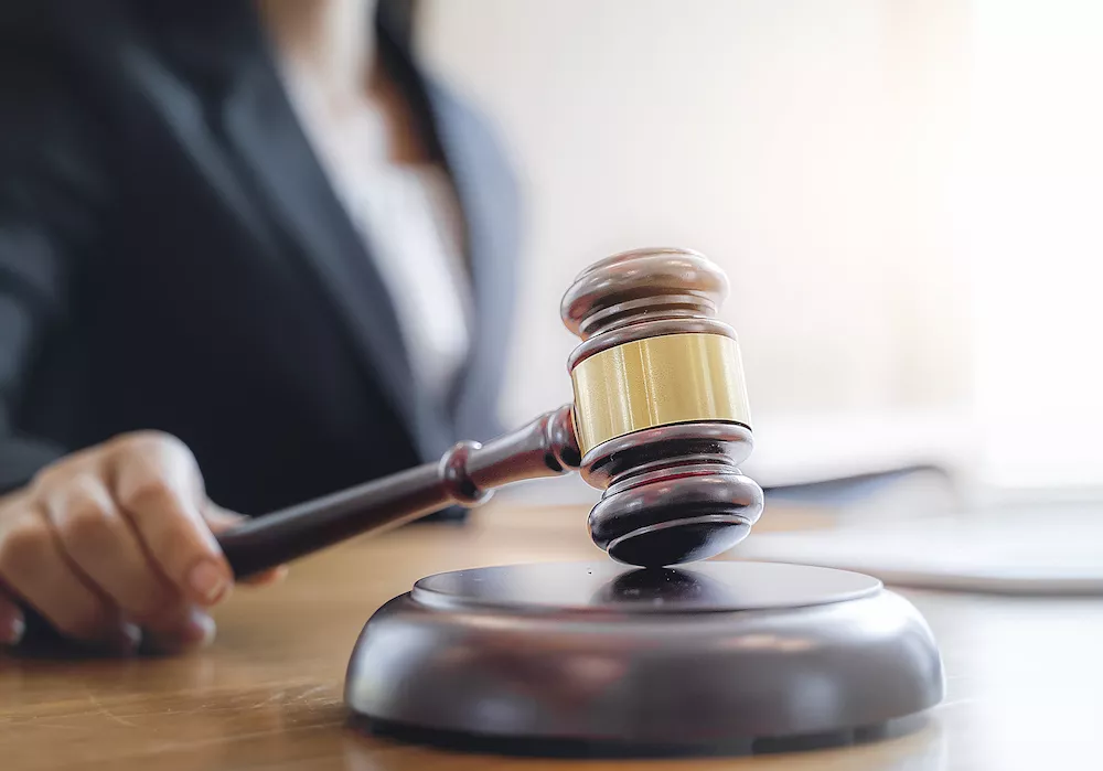 A gavel rests on a desk