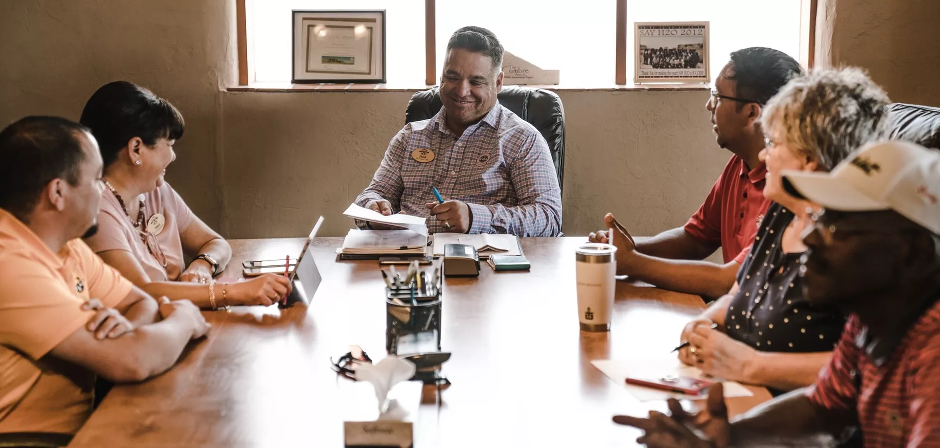 Educators convene around a table