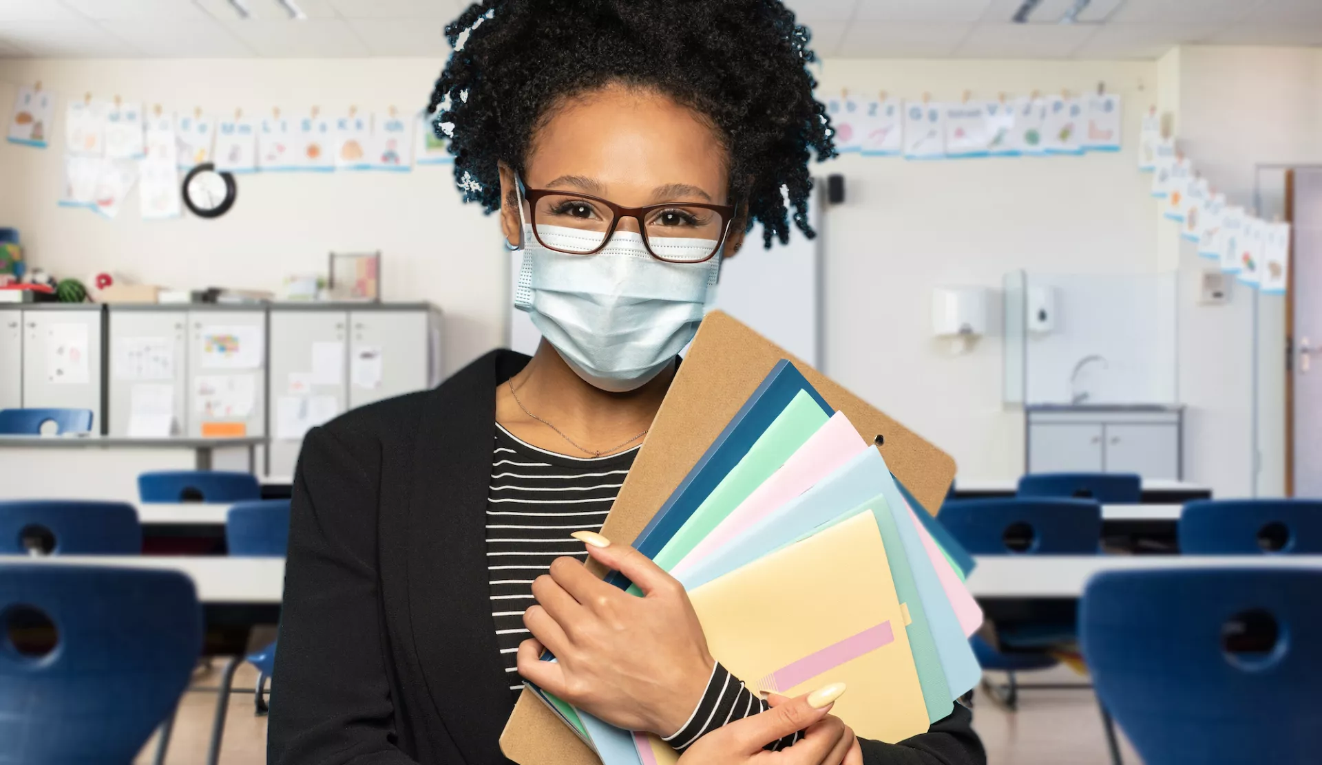 teacher in classroom with facemask