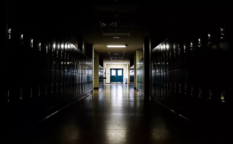 Darkened school hallway