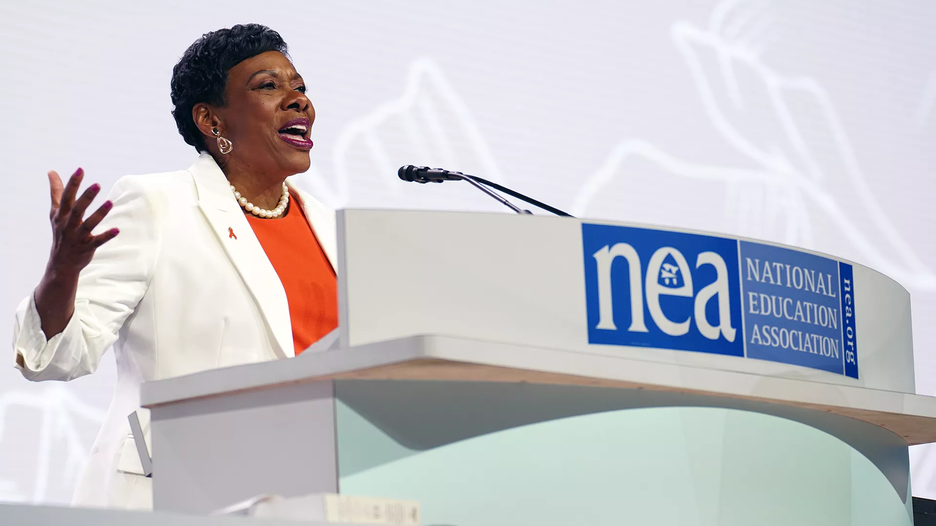 NEA President Becky Pringle addresses NEA RA delegates from the podium