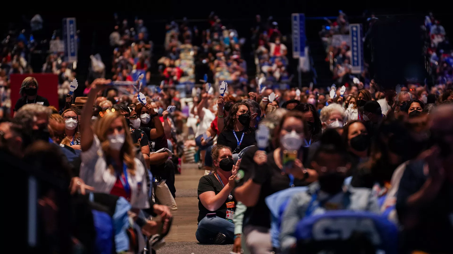 Delegates to the 2022 NEA Representative Assembly listen to debate on the RA floor.