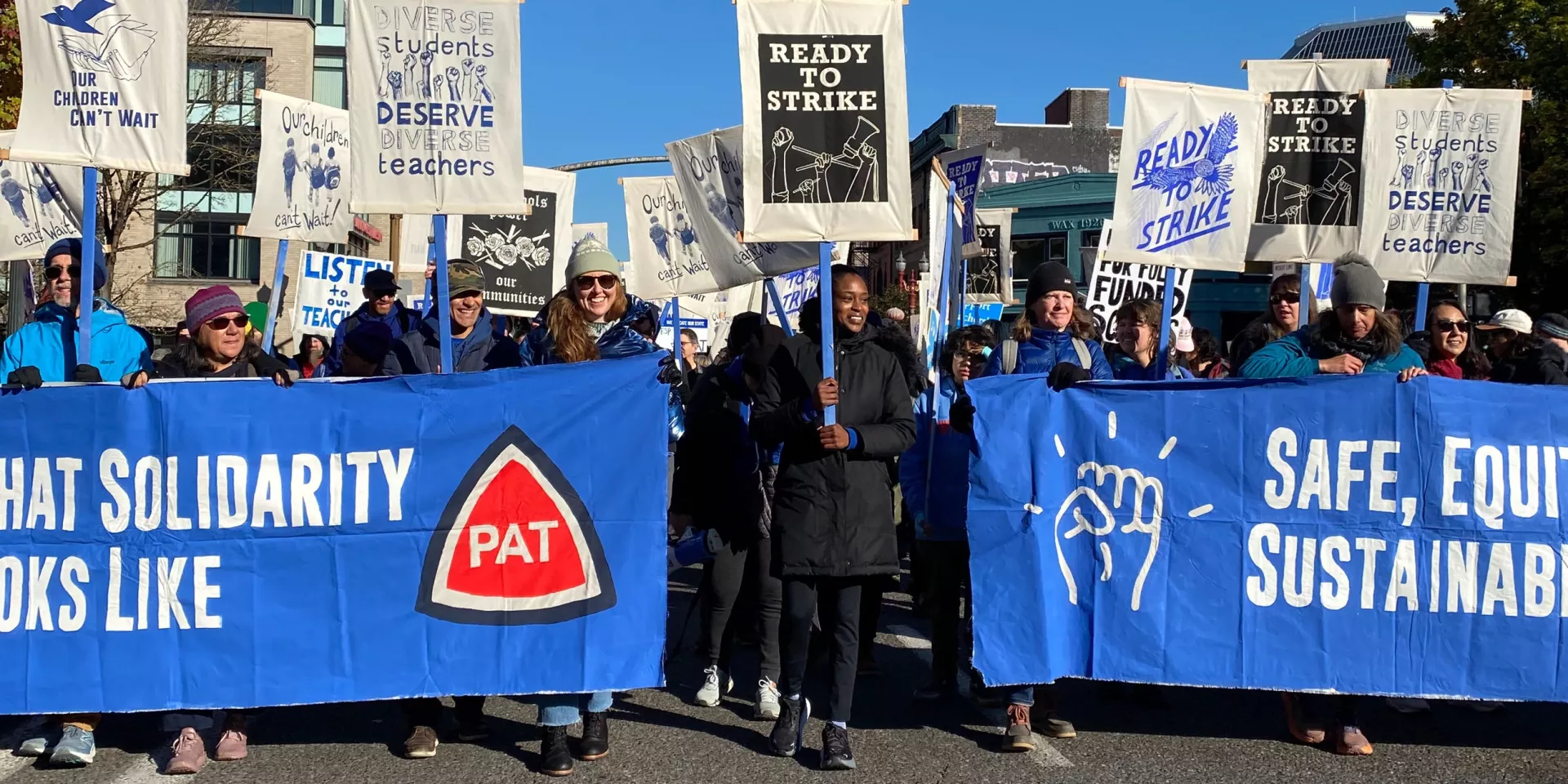 Photo of Portland teachers with banners and signs