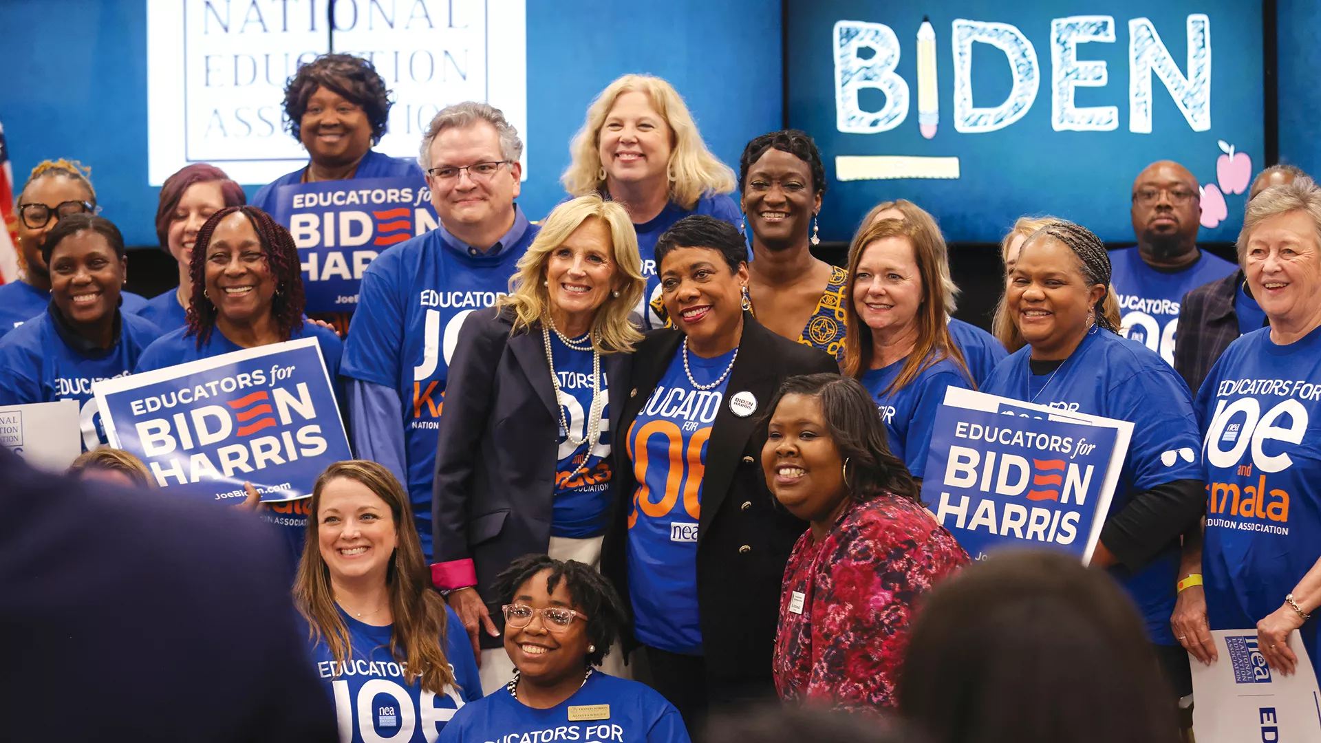 NEA President Becky Pringle poses with First Lady Jill Biden and several educators at a political rally