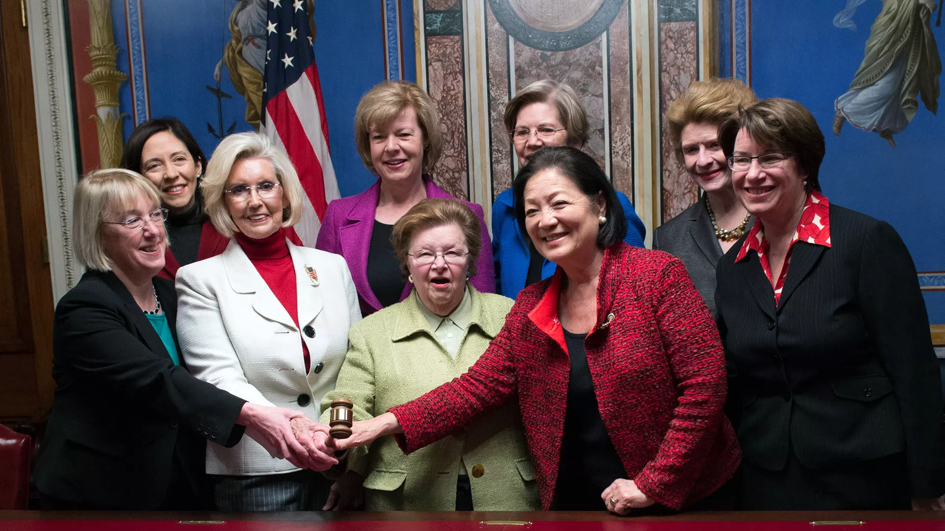 pay activist Lilly Ledbetter stands with 8 women U.S. senators