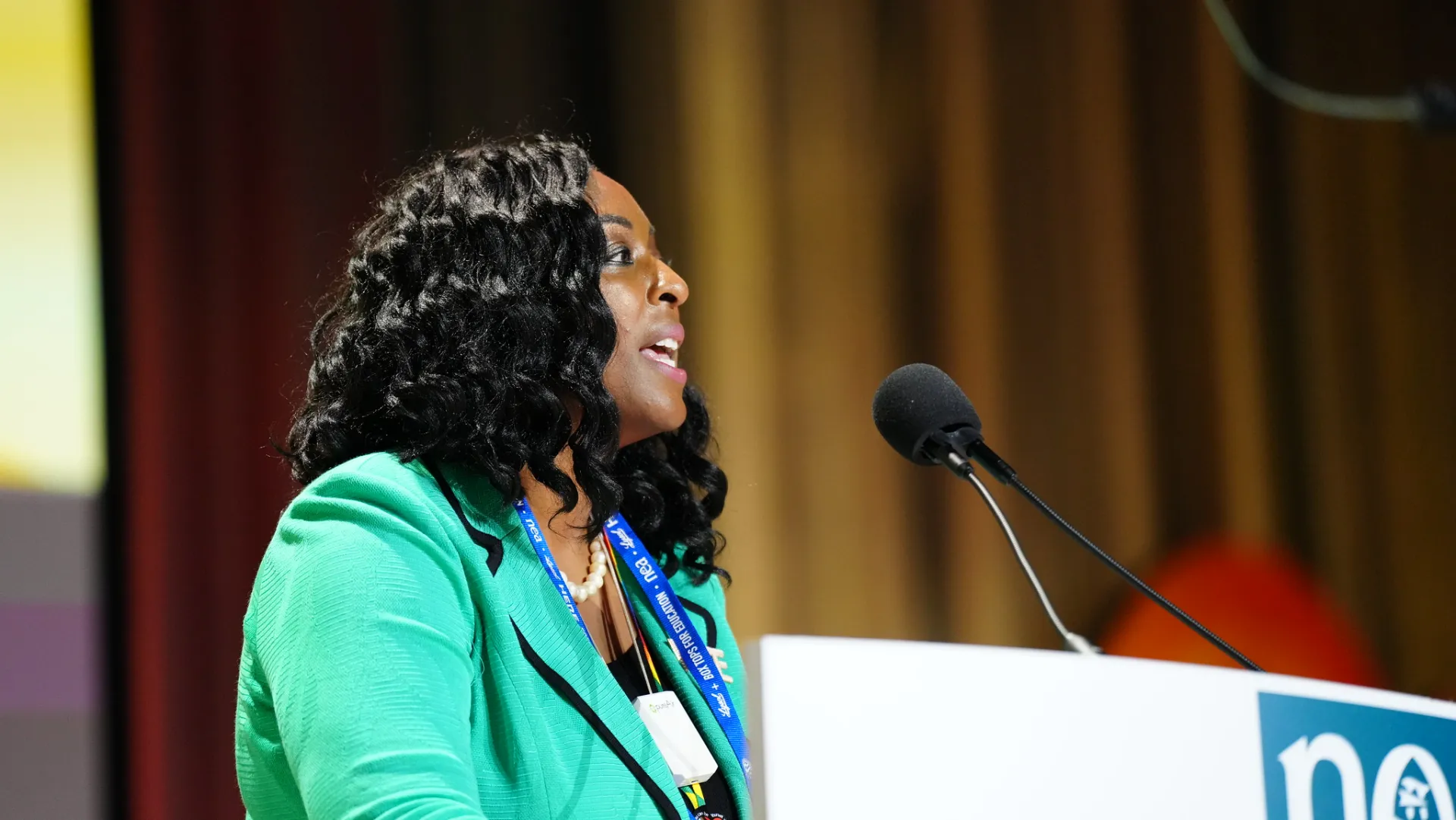 Tia Mills delivers election speech to RA delegates