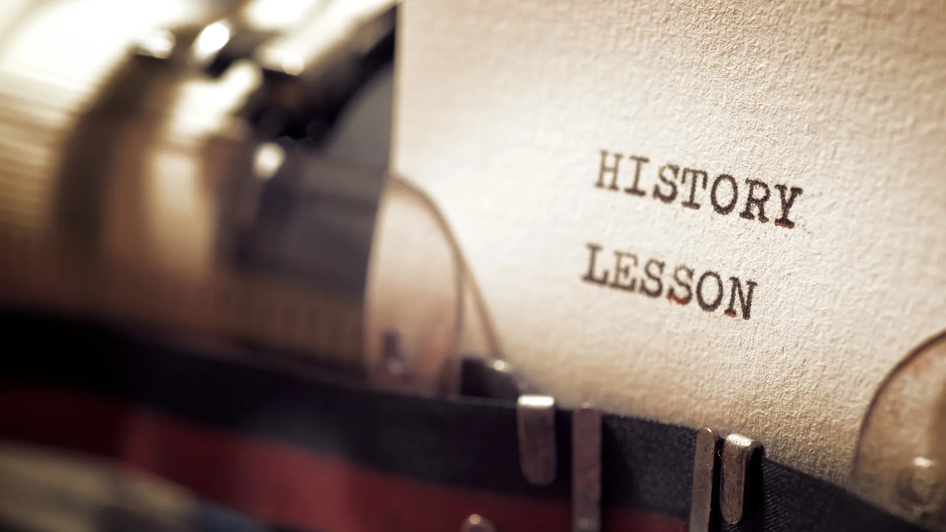 Typewriter text of the phrase "History Lesson."