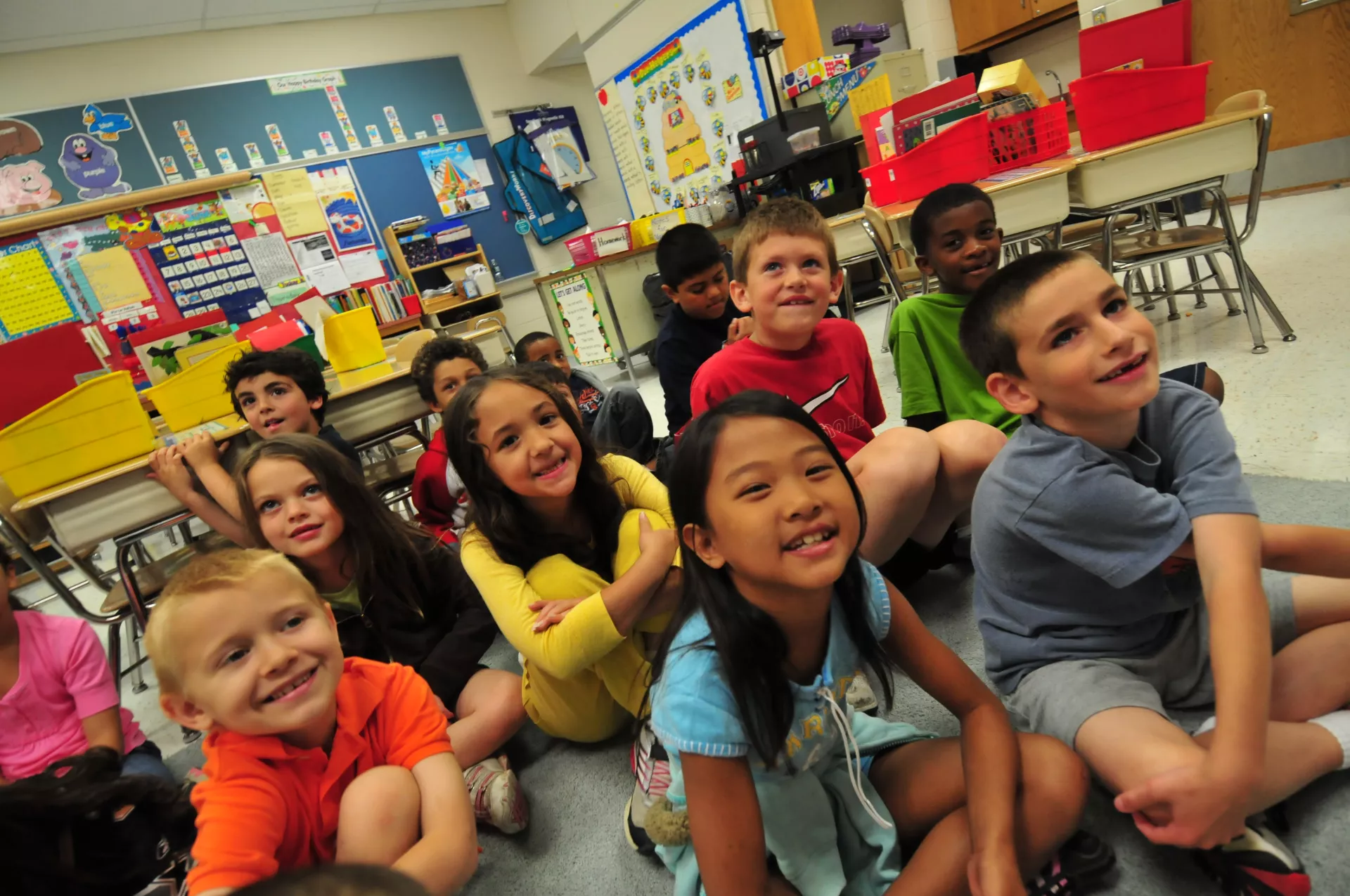Elementary students sitting on the classroom rug