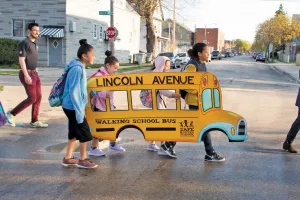 In Milwaukee, the Lincoln Avenue Community Elementary School created a walking school bus that “picks up” students and escorts them safely to school. 