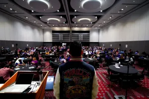 Back view of speaker, full room of RA delegates