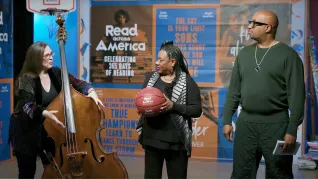 Bassist Amy Shook and NEA President Becky Pringle demonstrate musical rhythm with a basketball while Kwame Alexander looks on