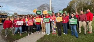 Mass teachers with signs