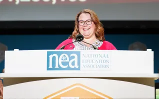 2025 Teacher of the Year Ashlie Crosson addresses RA delegates from the stage