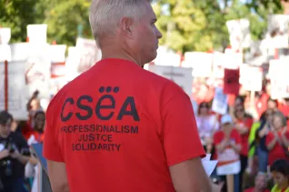 Educator in a T-shirt that says CSEA: Professionalism, Justice, Solidarity
