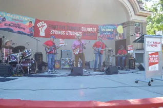 Band on a stage plays at CSEA rally