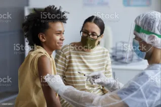 A child is vaccinated against COVID-19