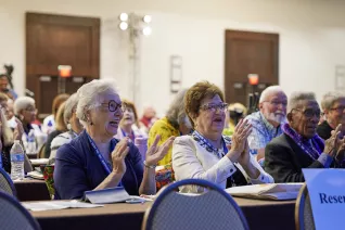 Attendees applaud a speaker at the 2023 NEA Retired Annual Meeting