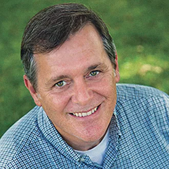 headshot of Allen Weeks wearing a blue shirt