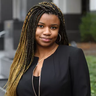 Headshot of Alana Rigby standing outside