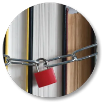 A chain and lock around a line of books.