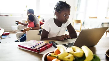 girl on computer at home