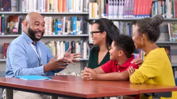 Teacher with Parents and Student
