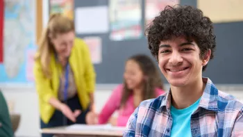 A smiling male high school student