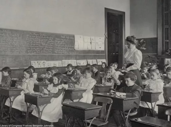 Famale teacher in 1800s classroom