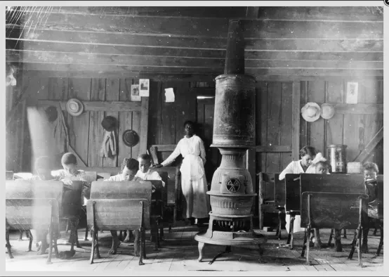 AA teacher in early 20th century schoolhouse