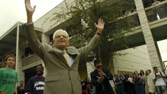Braulio Alonso in front of namesake school