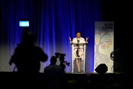 Becky Pringle addresses educators from a stage in Kentucky