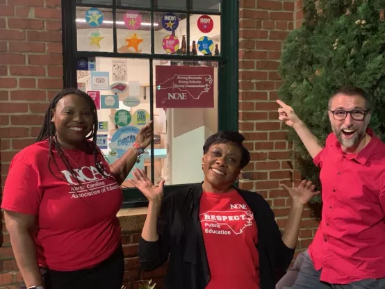 NEA President Becky Pringle poses with two leaders outside the headquarters of the North Carolina Education Association