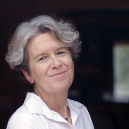 Portrait-style photo of Anna Peterson, white woman with graying hair