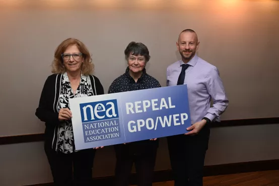 NEA members hold up a sign that reads "Repeal GPO/WEP"
