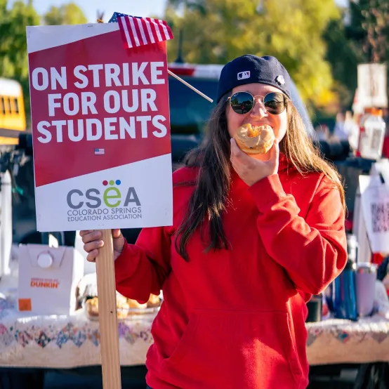 CSEA Member holding a picket sign