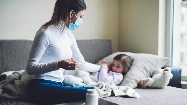 A mom tends to a sick child