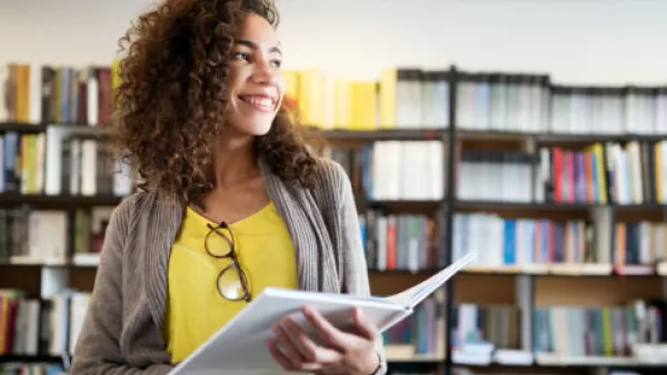 Smiling student in library