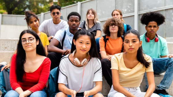 10 diverse high school students sit outside on a bench