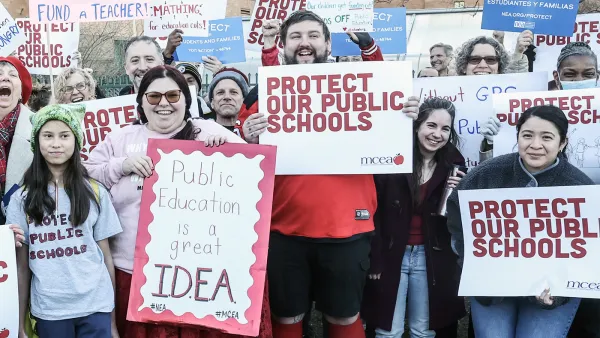 Protester hold up signs asking protect our public schools