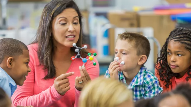 Teacher with young students