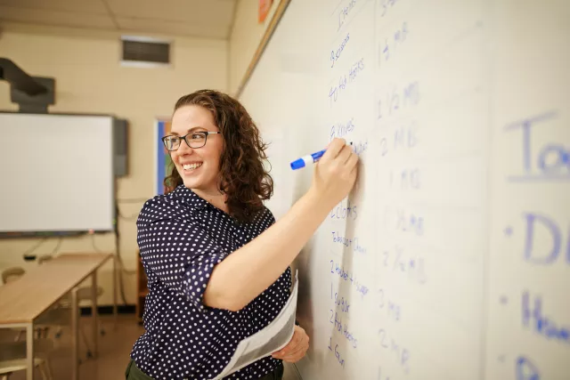 Teacher at whiteboard