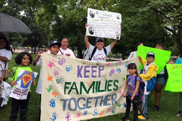 Protest with sign that says Keep Families Together