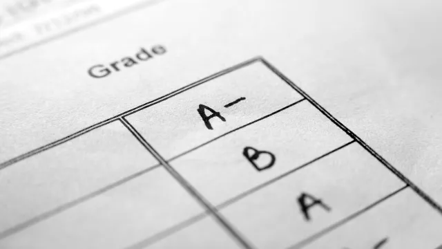 black and white mock up of a report card with grades in one column