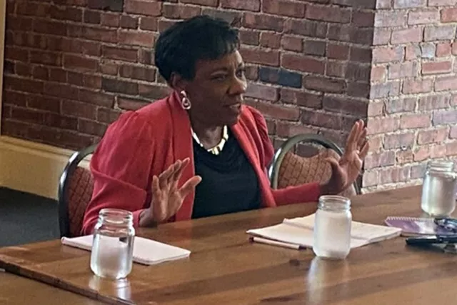 NEA President Becky Pringle talks with educators at a restaurant in Illinois