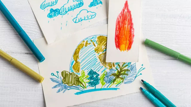 kid drawing of earth and a separate drawing of fire