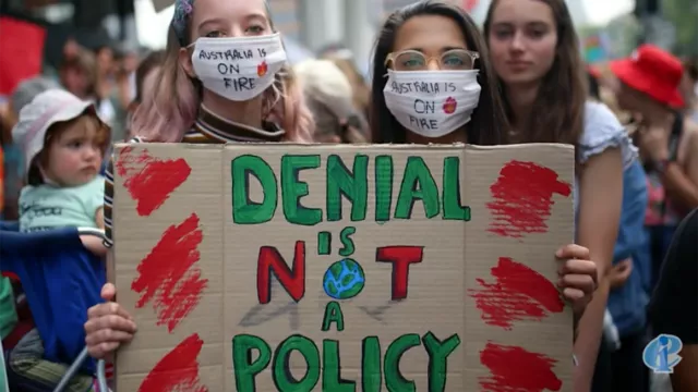 Two young girls protest climate change denying policies