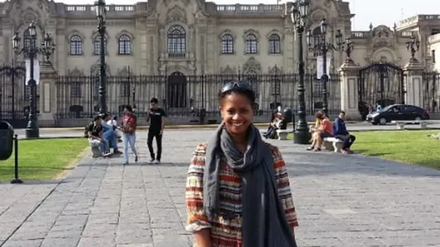 Terri Butts in stands outside the presidential palace in Peru